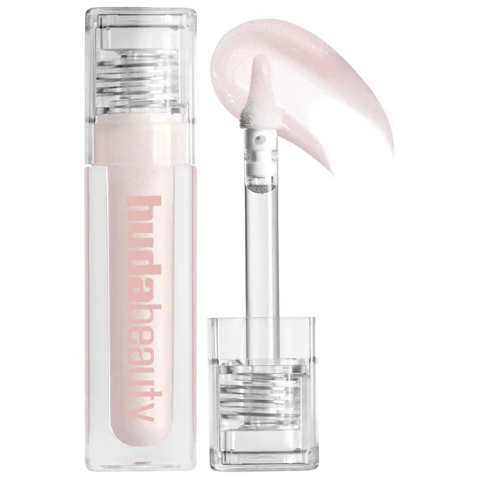 Huda Beauty hydrating lip gloss in sheer shimmering pink with doe-foot applicator and clear tube packaging.