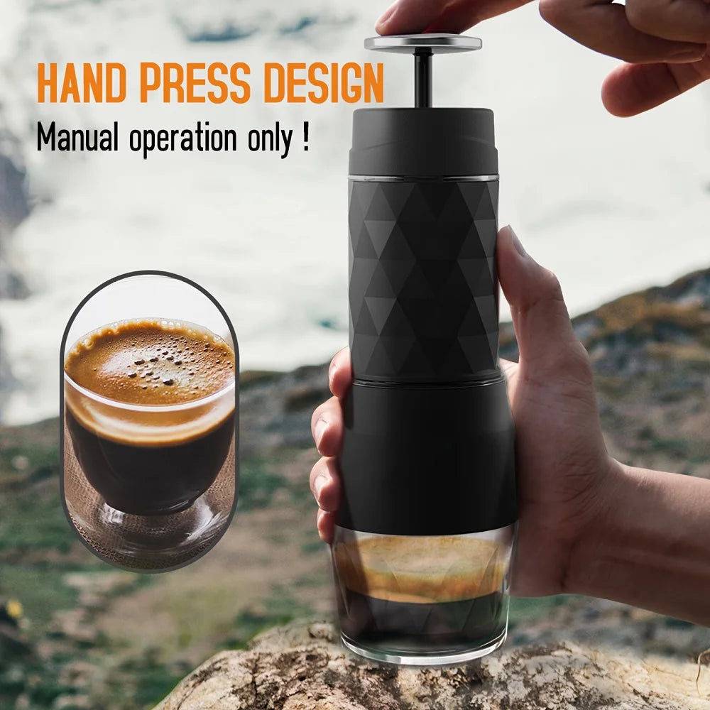 Portable black manual hand-press coffee maker with geometric texture, brewing espresso outdoors.