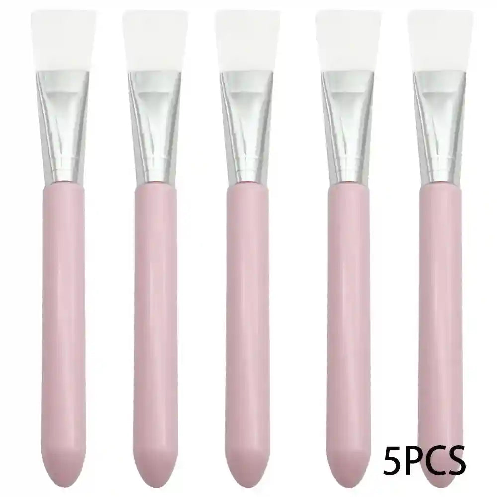 Five face mask brushes with white silicone heads, silver ferrules, and light pink smooth handles.