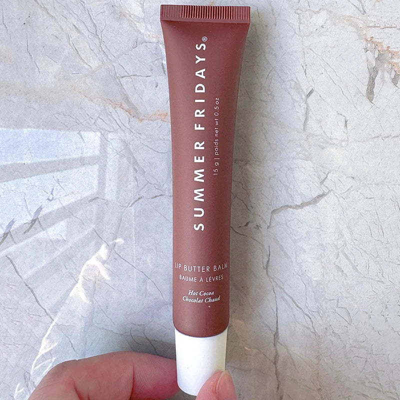 Summer Fridays Lip Butter Balm in Hot Cocoa, a moisturizing brown tube for smooth, glossy lip makeup.