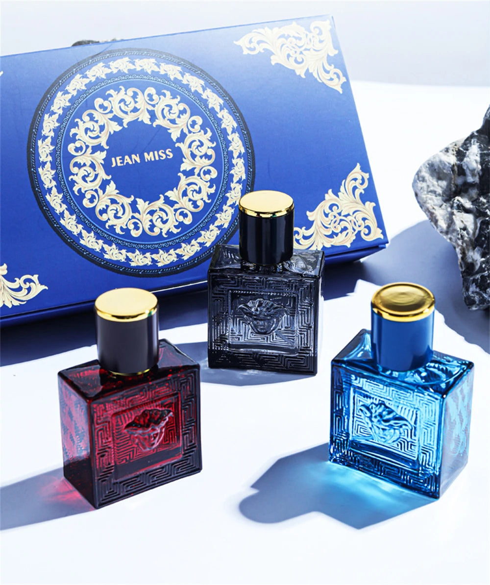 Jean Miss 3pc men's cologne gift set. Square glass bottles with Medusa emblem and gold caps. Long-lasting fragrance.