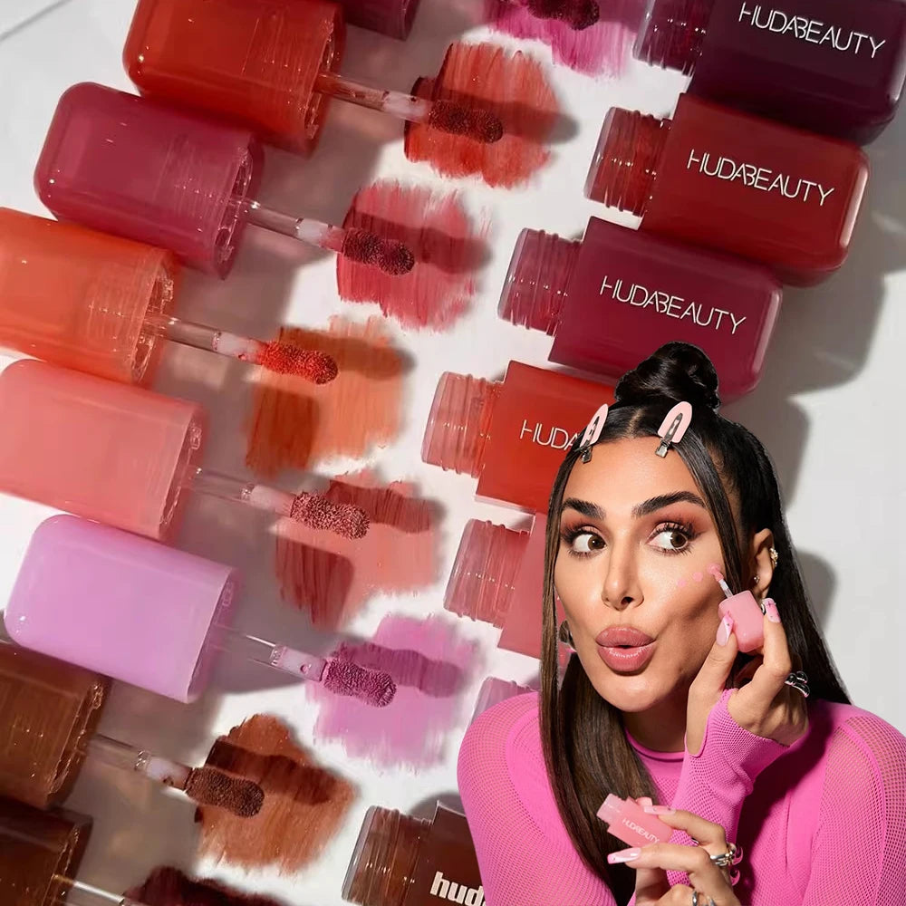 Model applying hydrating lip and cheek tint in various vibrant shades. Creamy, pigmented liquid blush and lipstick set.