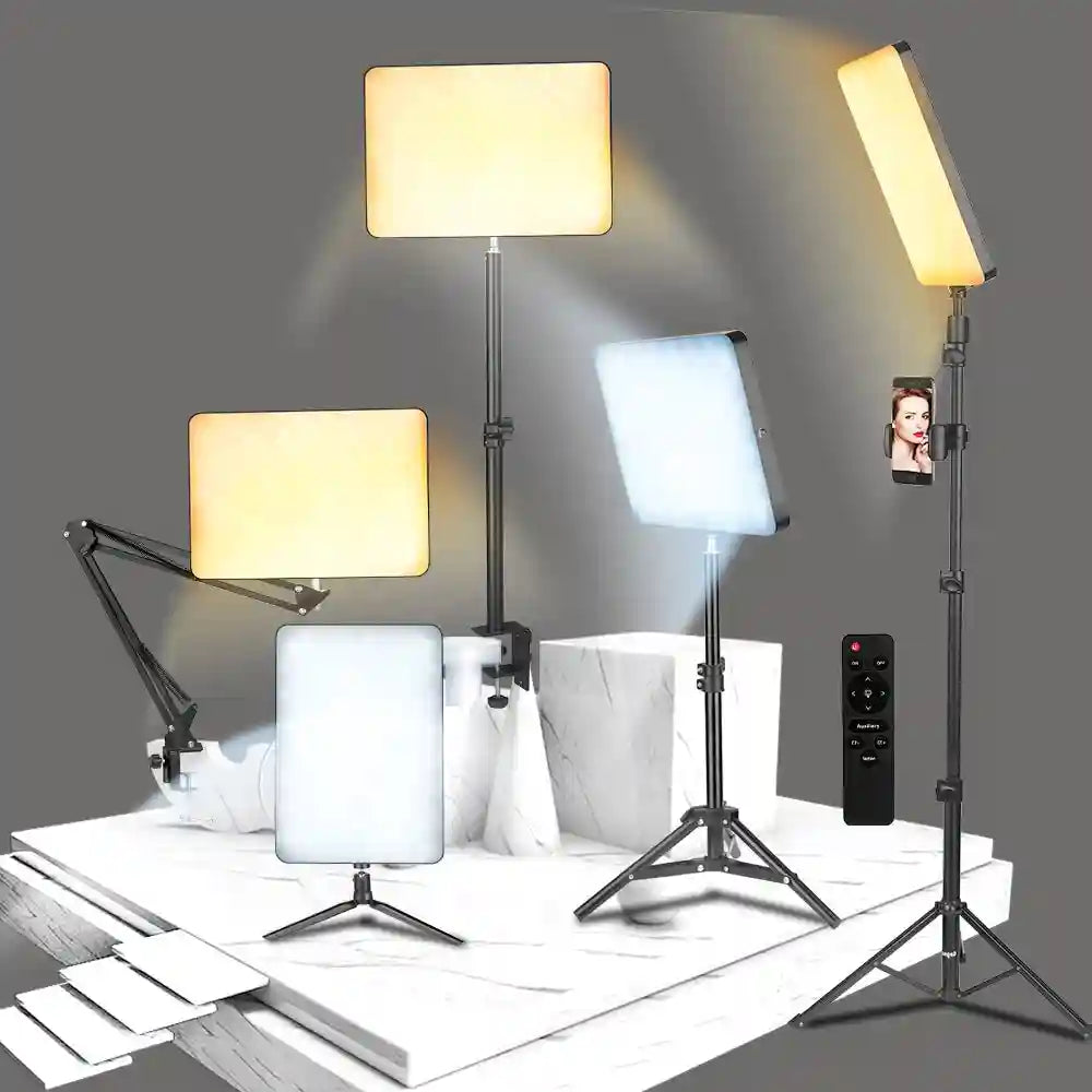 Rectangular LED studio lights on tripod and desk mounts with adjustable color temperature, including a remote control.
