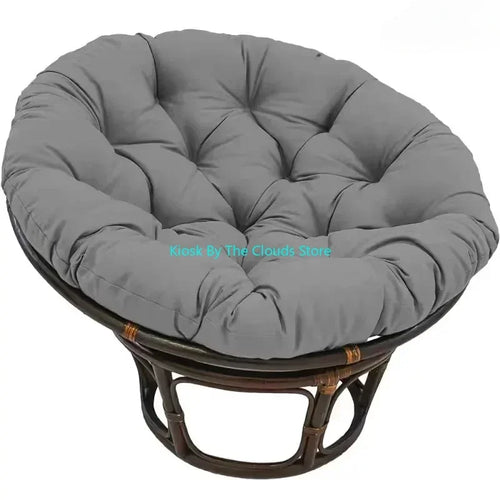Grey tufted circular meditation cushion on rattan frame, perfect for mindful relaxation and comfortable yoga seating.