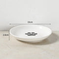 White 15cm ceramic cat and dog bowl with paw print for easy, whisker-friendly feeding and water.