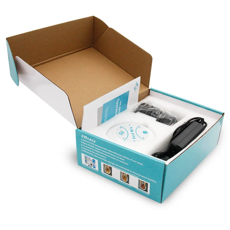 Unboxed ionic detox foot spa machine with control unit, power adapter, and array in a branded blue and white box.