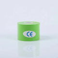 A roll of bright green cotton face-lifting tape with a white CE certification label on a reflective white surface.