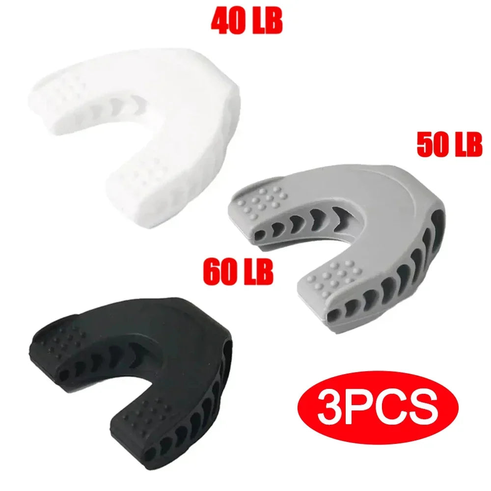Three horseshoe-shaped silicone jaw exercisers in white (40lb), grey (50lb), and black (60lb) with textured bite pads.