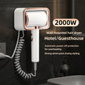 White and rose gold 2000W wall-mounted hair dryer with coiled cord, perfect for hotels and modern home bathrooms.