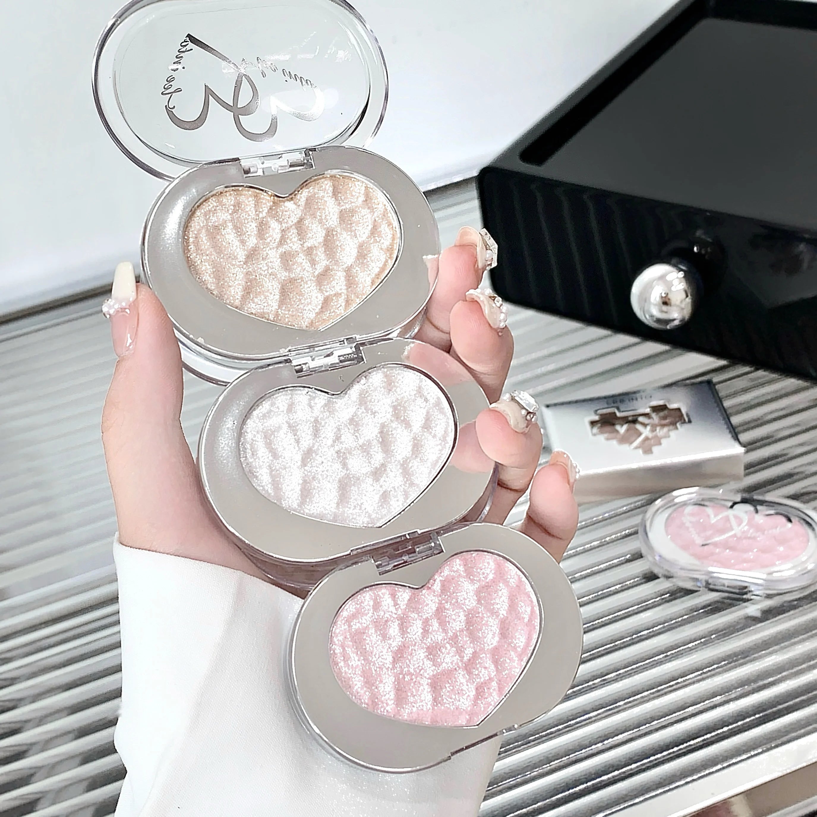 Tidesmit LEE INTO Highlighter Powder texture close-up showing silky pearlescent finish and fine shimmer