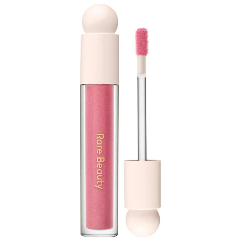 Rare Beauty Soft Pinch Tinted Lip Oil in a pink shade with applicator wand, featuring a glossy, moisturizing finish.