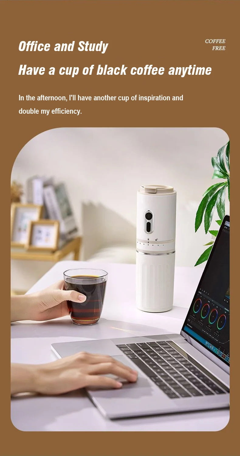 White portable coffee maker on office desk next to laptop with glass of black coffee.