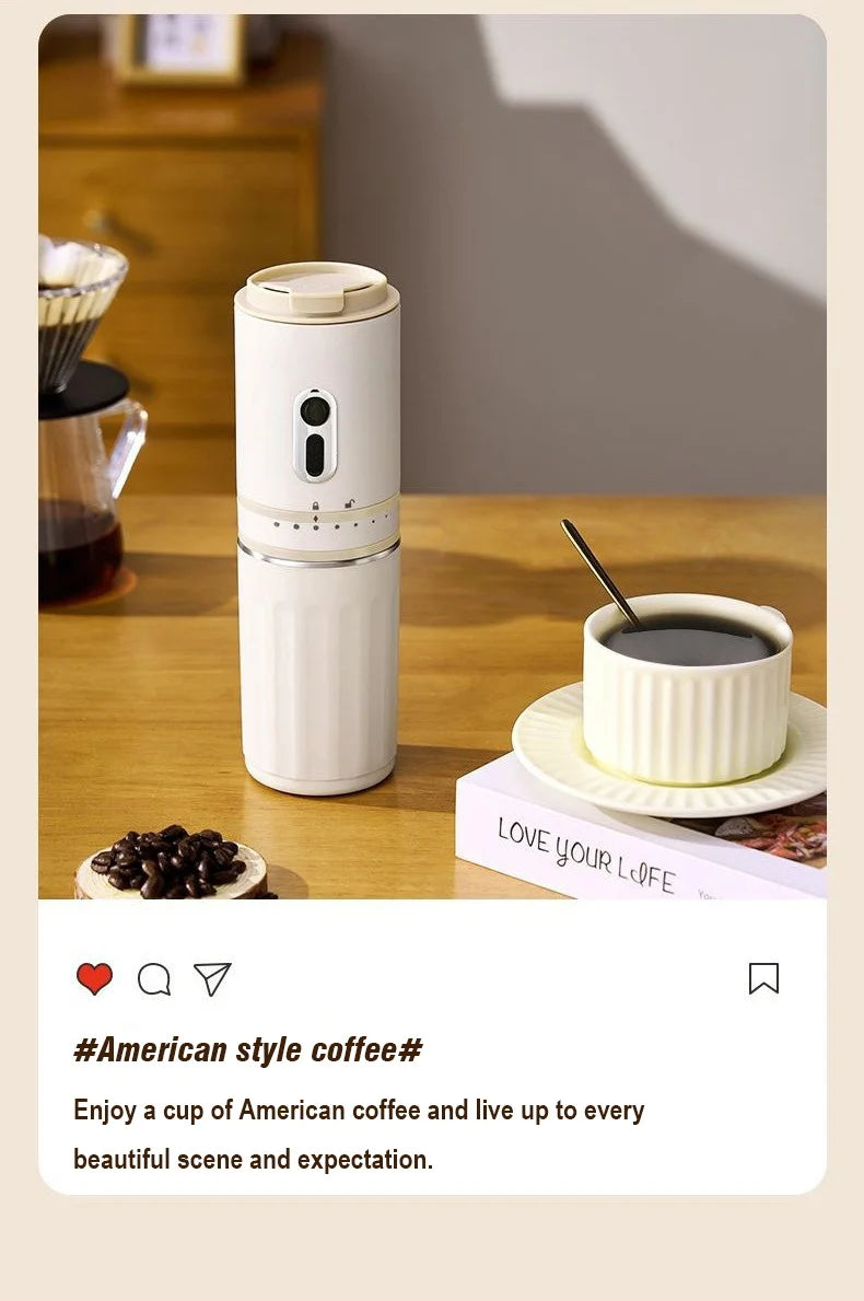 Portable white matte electric coffee maker for American-style coffee on a wooden table with a matching cup.
