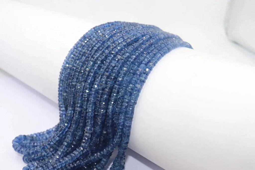 Curved kyanite rondelle bead strand, faceted blue beads with small drilled holes