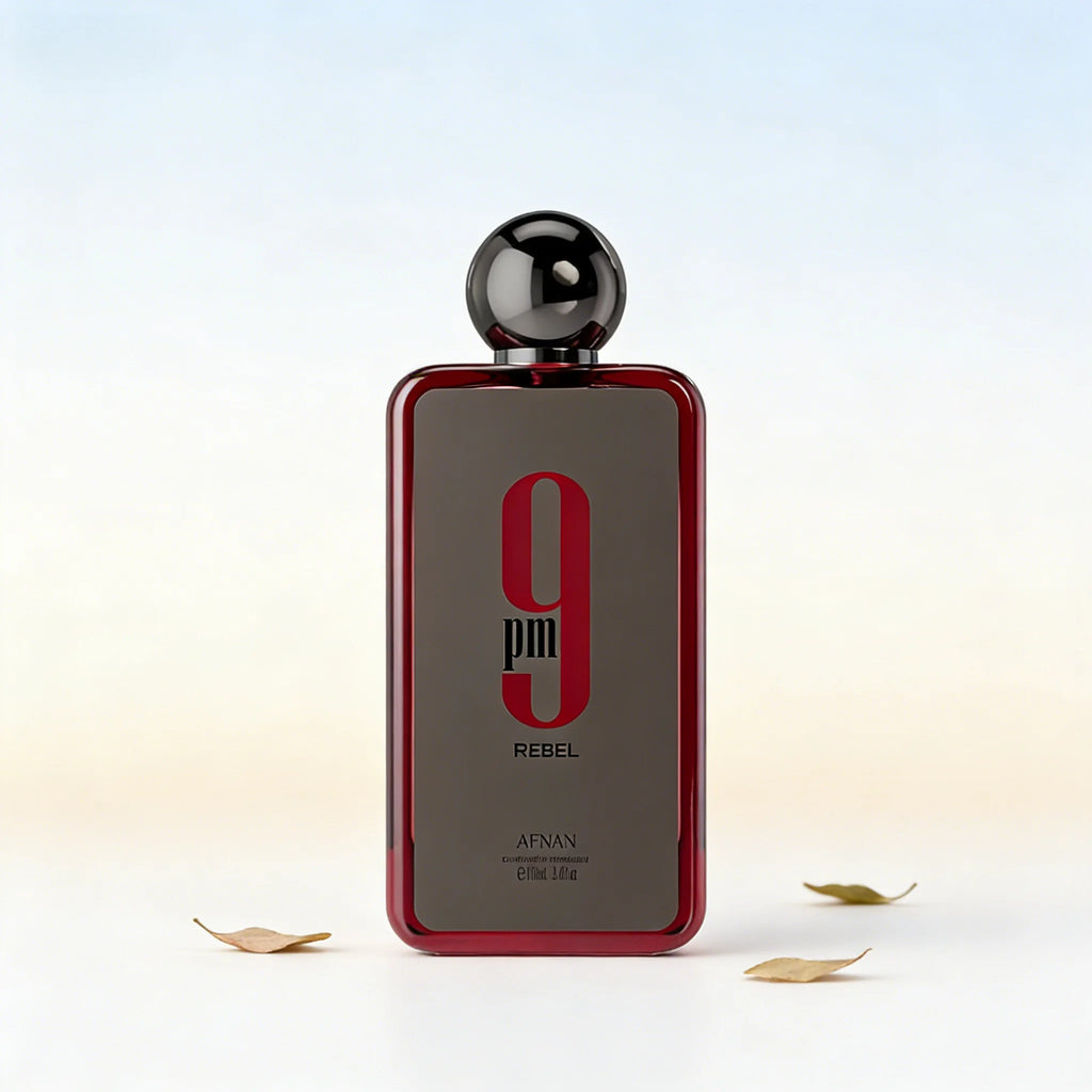 Afnan 9pm Rebel EDP for men: 3.4oz woody oud fragrance in a sleek, rectangular red glass bottle with a round cap.