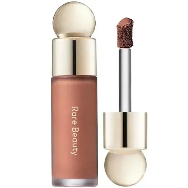Rare Beauty liquid blush in rose nude shade. Long-lasting, waterproof, and smooth applicator for lips and cheeks.