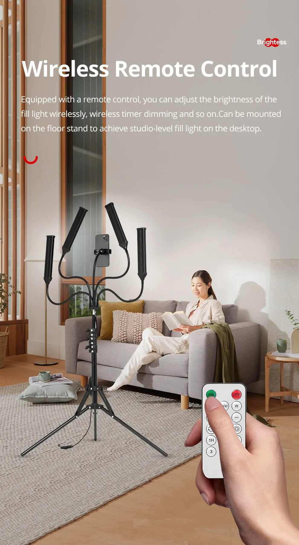 Black floor-standing fill light with four adjustable arms, a phone mount, and a wireless remote for studio lighting.