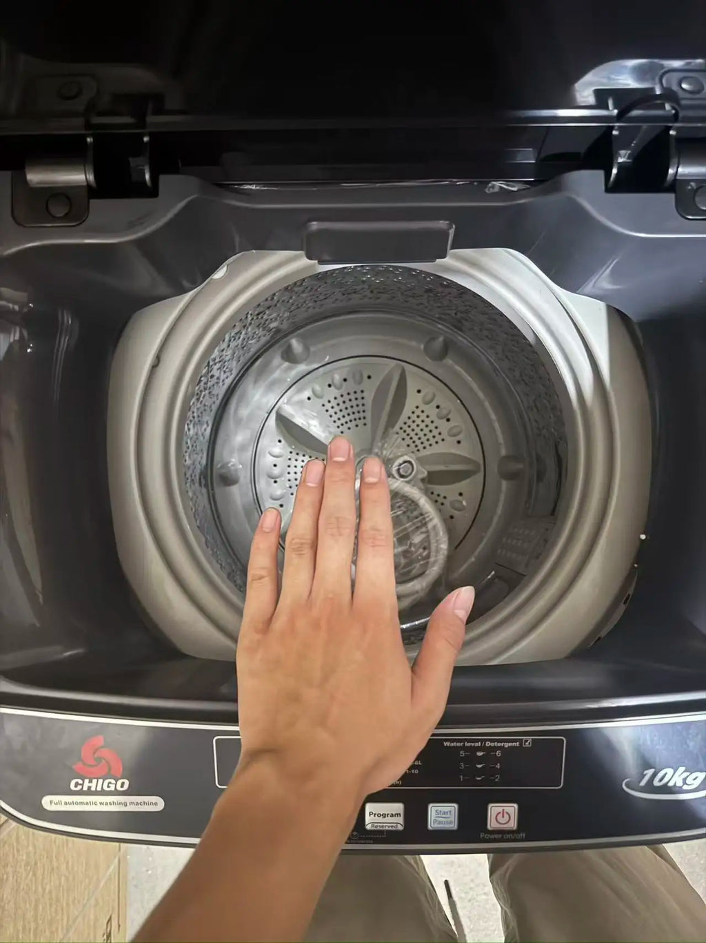 Tidesmit 10kg automatic top load washer dryer combo featuring interior drum and control panel details