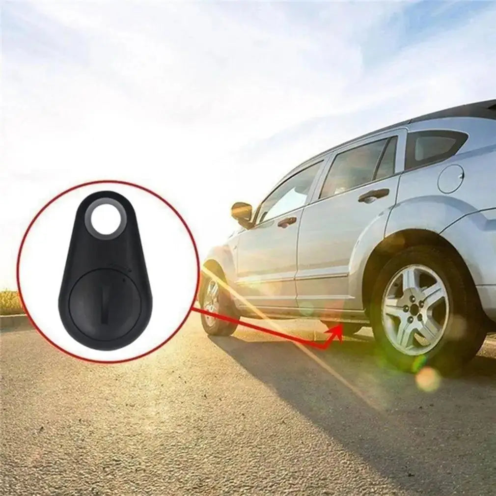 Black mini Bluetooth GPS tracker for pets and keys. Smart anti-lost alarm tag for easy location tracking.