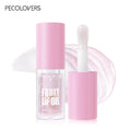 PECOLOVERS transparent fruit lip oil in pink packaging with applicator brush and glossy crystal jelly texture swatch.