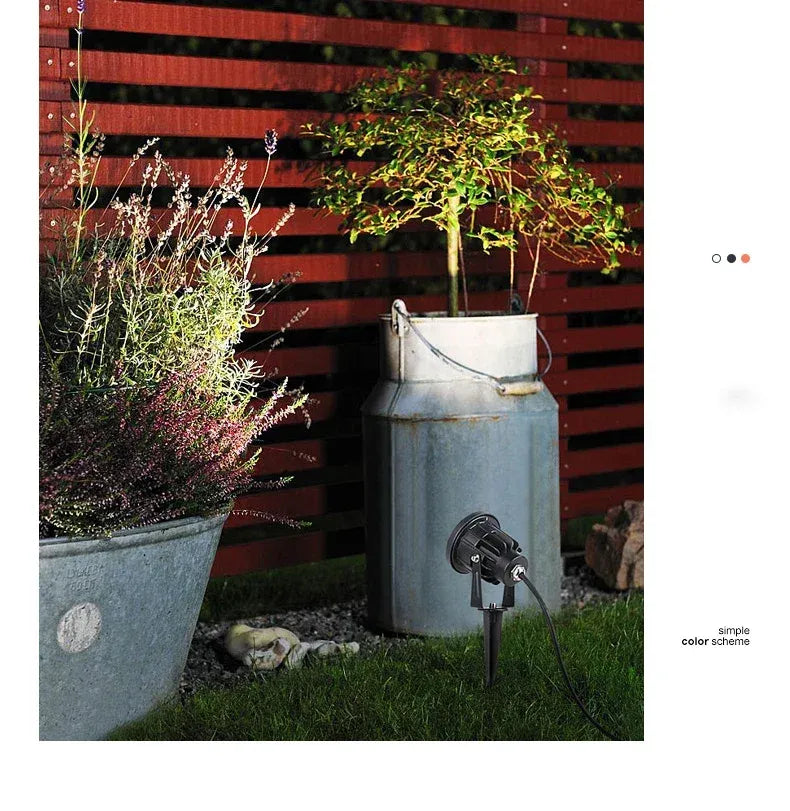 Black outdoor LED landscape spike spot light with round head and power cable