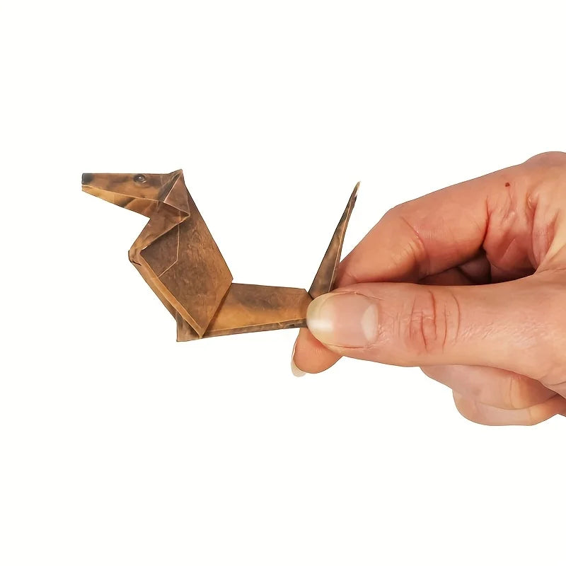 Handheld brown paper origami dachshund dog craft kit, perfect DIY decor gift for pet lovers.