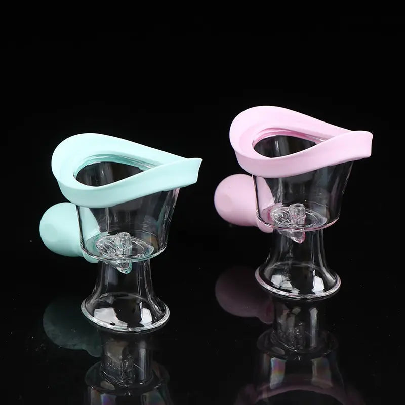Reusable soft silicone eyewash cups in blue and pink for eye cleaning, flushing, and rinsing at home.