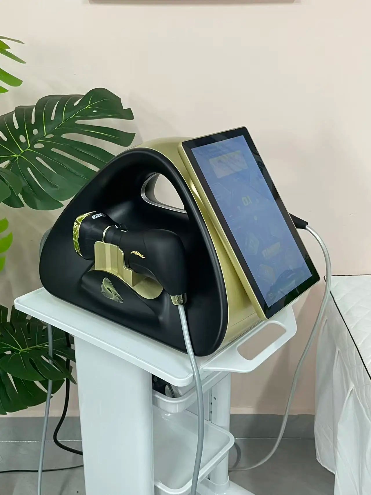 Tidesmit HIFU facial tightening device on stand with gold edges and touchscreen display
