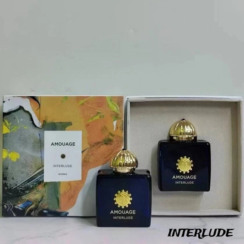 Amouage Interlude Woman EDP: Blue square bottle with gold cap, luxury feminine fragrance set with elegant gift box.
