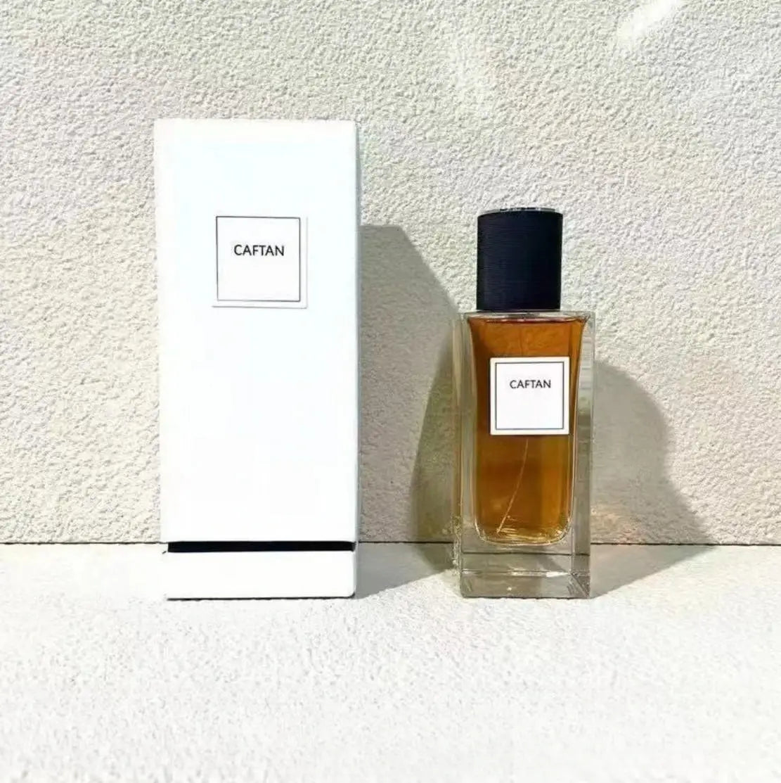 Caftan 125ml unisex perfume, oriental woody grapefruit floral scent, rectangular glass bottle with black cap.