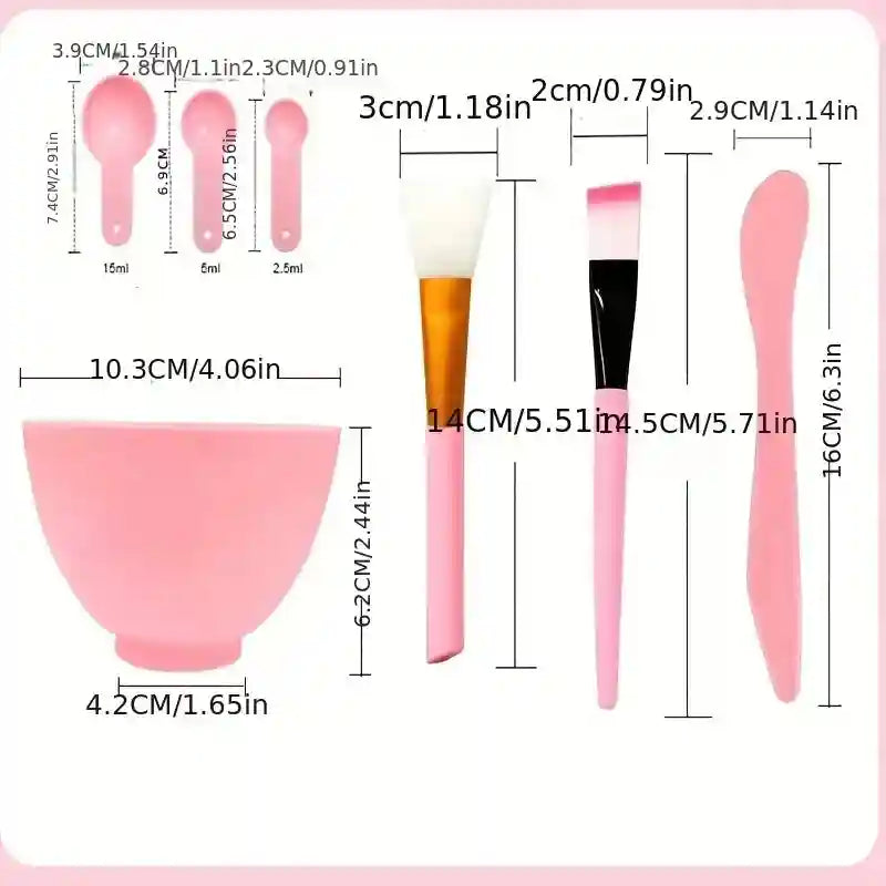 Pink 7-piece DIY face mask tool kit including a silicone bowl, measuring spoons, brushes, and a spatula with dimensions.