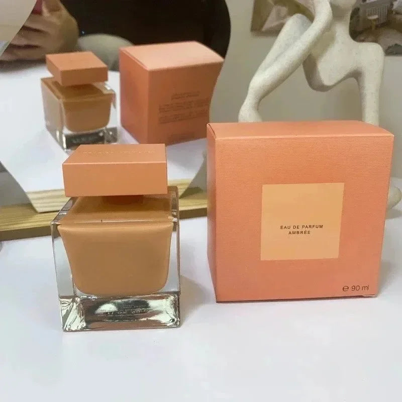 Narciso Rodriguez Ambrée EDP: Square glass bottle, woody floral musk perfume for women. Long-lasting luxury fragrance.