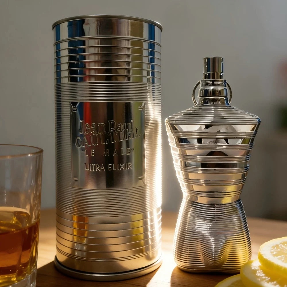 Jean Paul Gaultier Le Male Ultra Elixir men’s perfume. Metallic torso bottle and silver tin packaging with lemon notes.