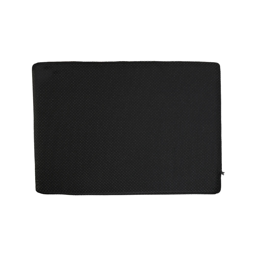 Black ergonomic under desk foot rest with non-slip texture, ideal for office or gaming chair comfort.