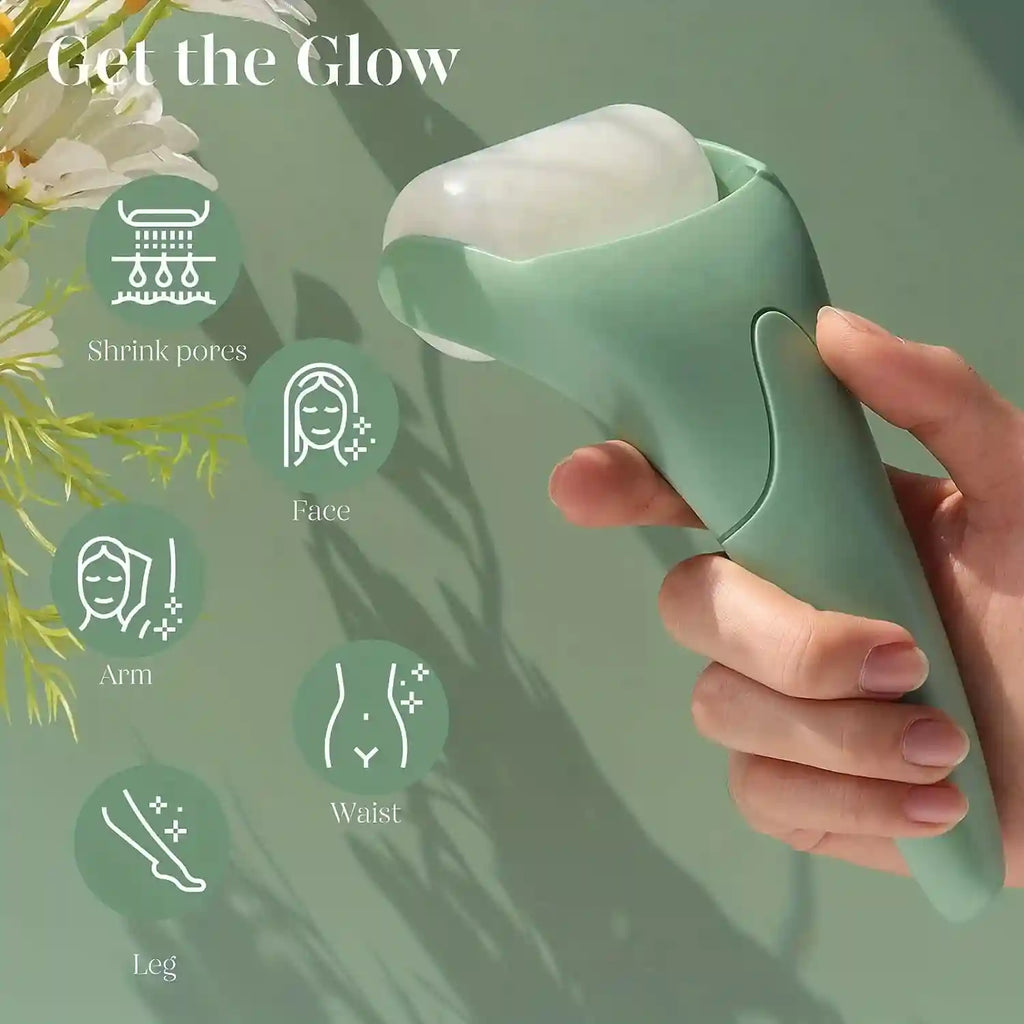 A hand holds a sage green handheld ice roller with a white cylindrical cooling head against a light green background.
