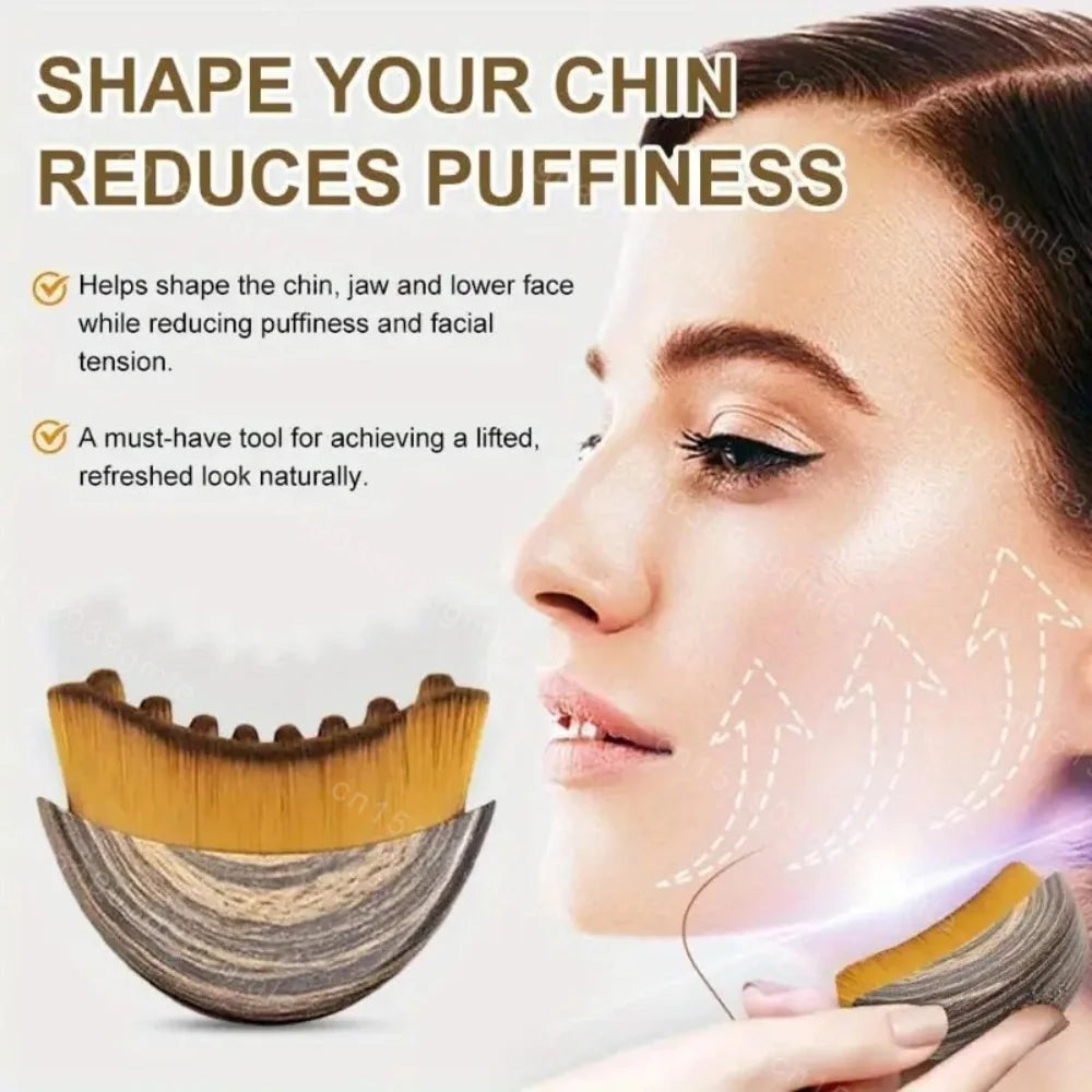 A curved, wood-patterned facial massage brush with soft bristles used for jawline contouring and lymphatic drainage.