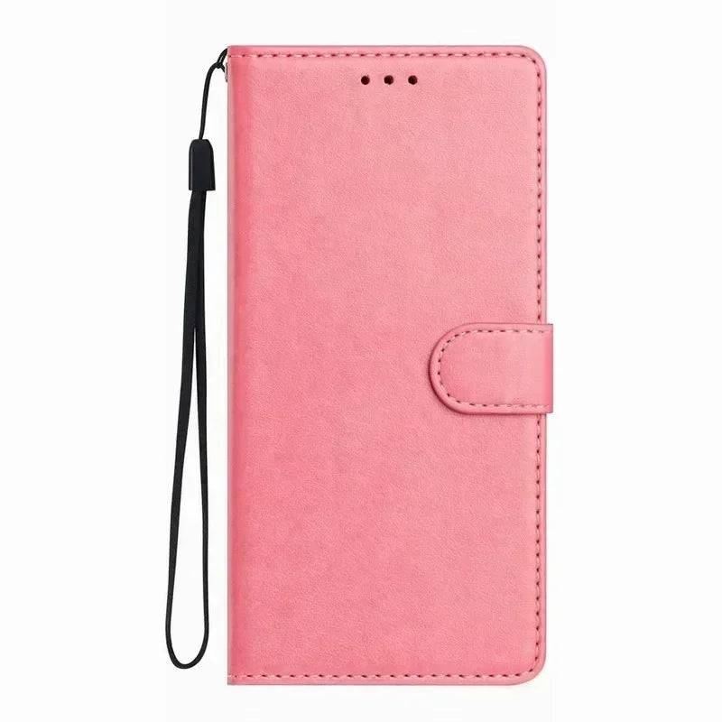 Pink leather wallet phone case with a magnetic closure and black wrist strap for carrying and protection.