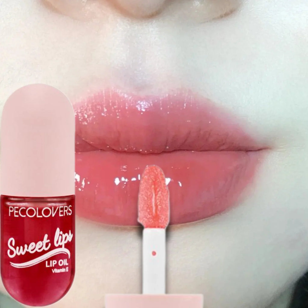 Moisturizing fruity lip oil with shiny, plump pink tint and doe-foot applicator for long-lasting, glossy lip makeup.