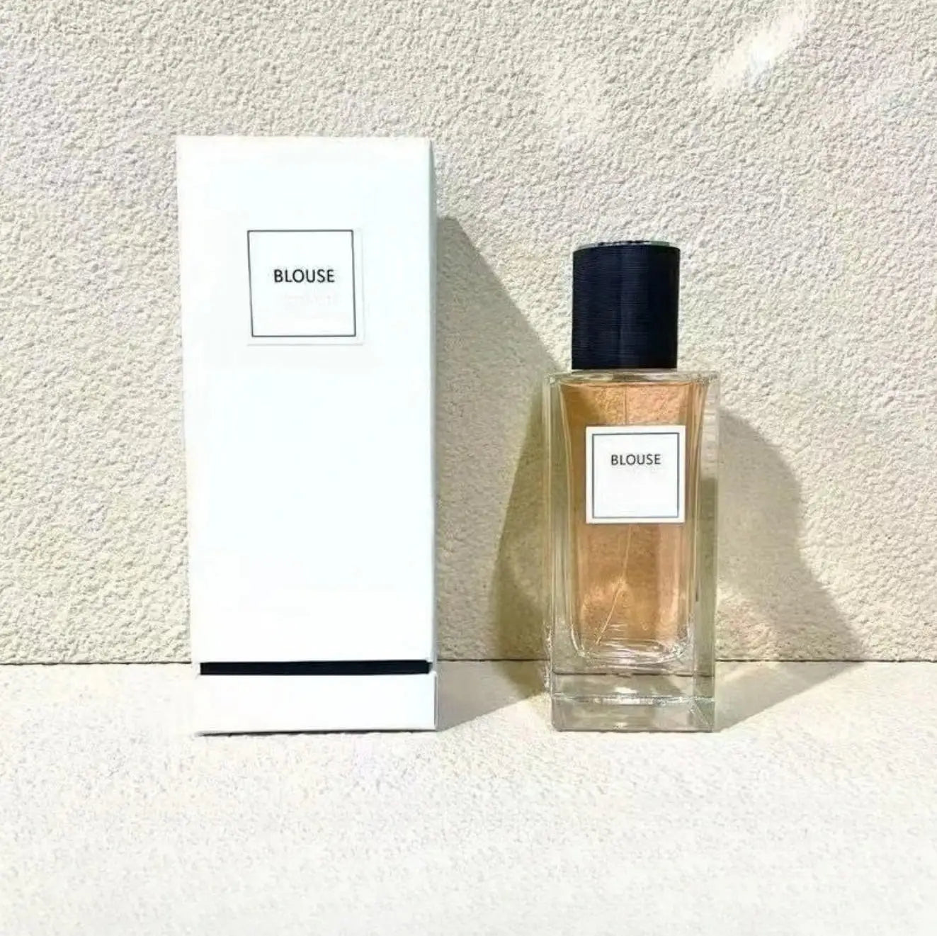Blouse 125ml unisex perfume: oriental woody, grapefruit, floral scent in a sleek rectangular glass bottle. Long-lasting.