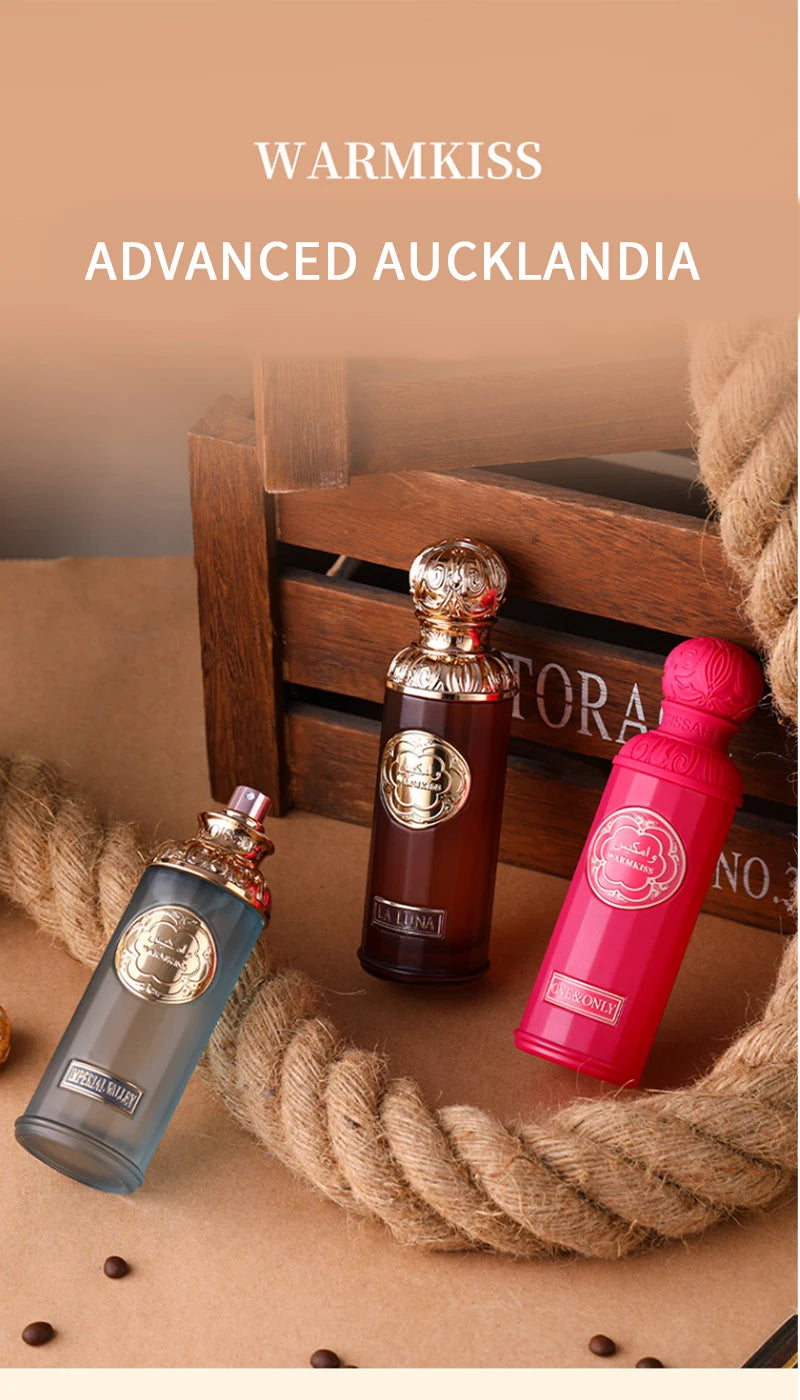 Warmkiss unisex Eau de Parfum set in ornate glass bottles. Luxury Arabian long-lasting oud scent for men and women.