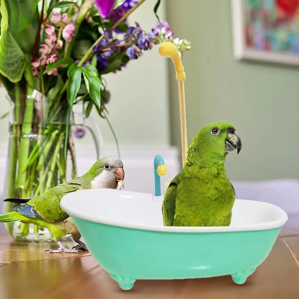 Green parrot automatic bathtub with shower faucet for parakeets. Plastic bird bath cage accessory for fun grooming.