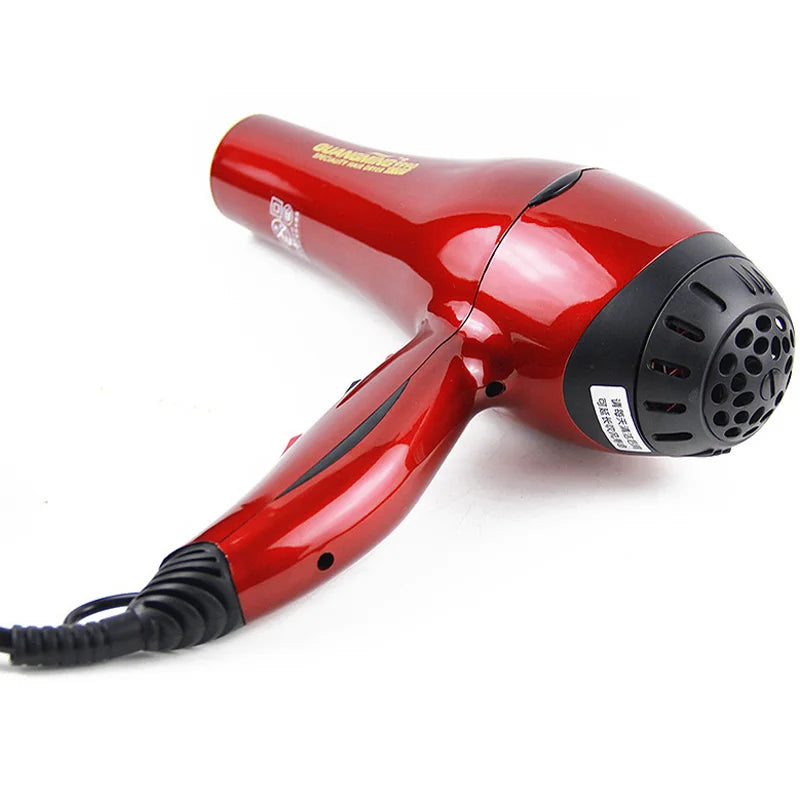 Professional 2300W red salon hair dryer with long cord, ergonomic design, and black rear air intake vent.