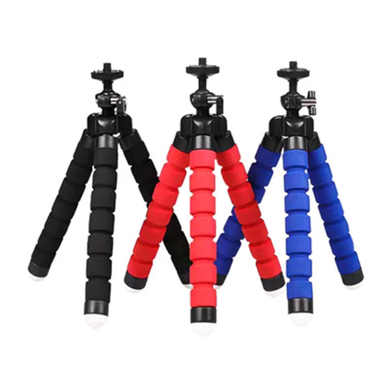 Three flexible foam tripods in black, red, and blue for steady smartphone or camera placement.