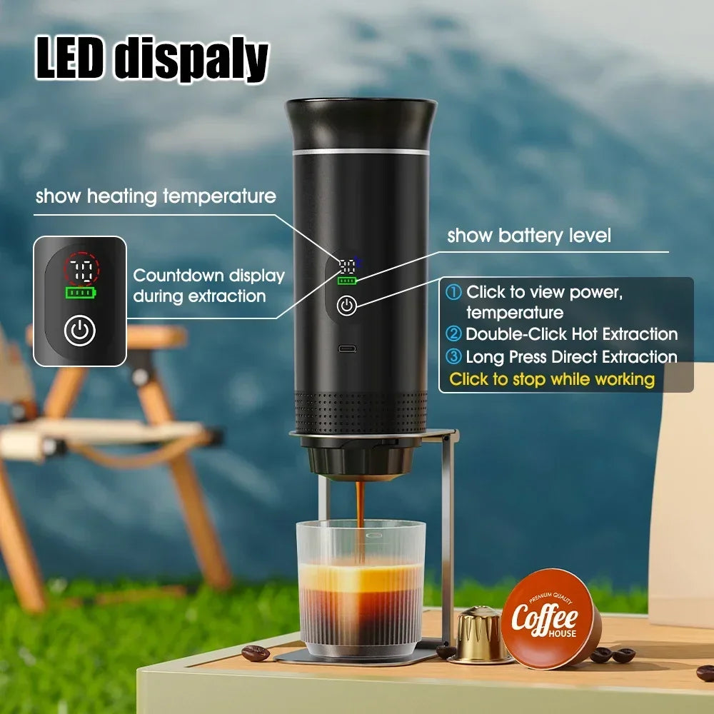 Black portable electric espresso maker with LED temperature and battery display, stand, and clear glass cup for travel.
