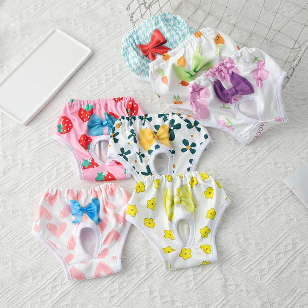 Washable, reusable floral and strawberry print diapers for small dogs and cats to manage pet menstruation comfortably.