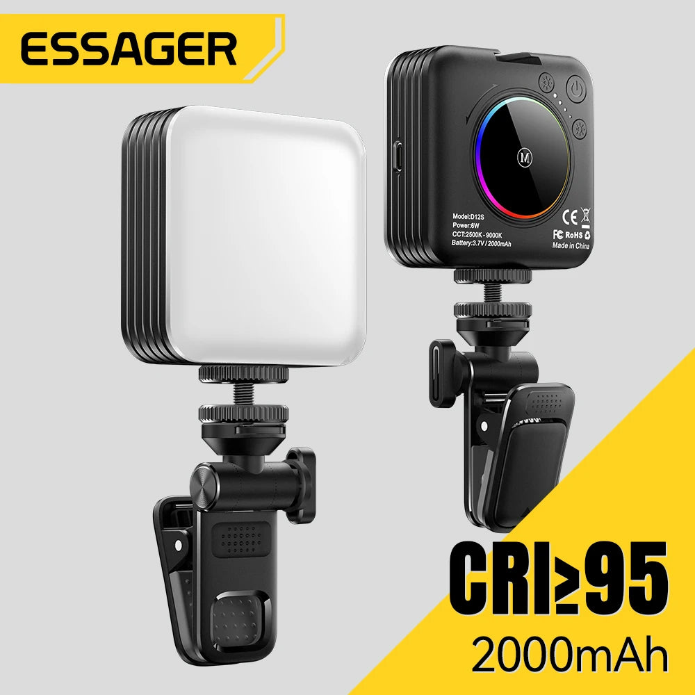 Square black LED video light with a clip mount for phone or camera, featuring a white diffuser and rear control dial.
