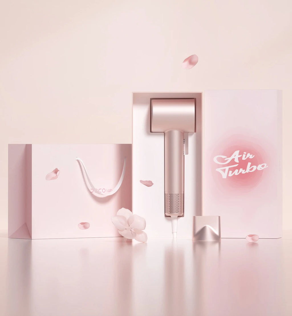 Rose gold DOCO high-speed hair dryer with nozzle attachment in gift box packaging, featuring negative ion technology.
