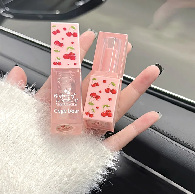 Gege Bear cherry lip balm and oil set in pink square tubes with moisturizing clear finish for soft, tender lips.