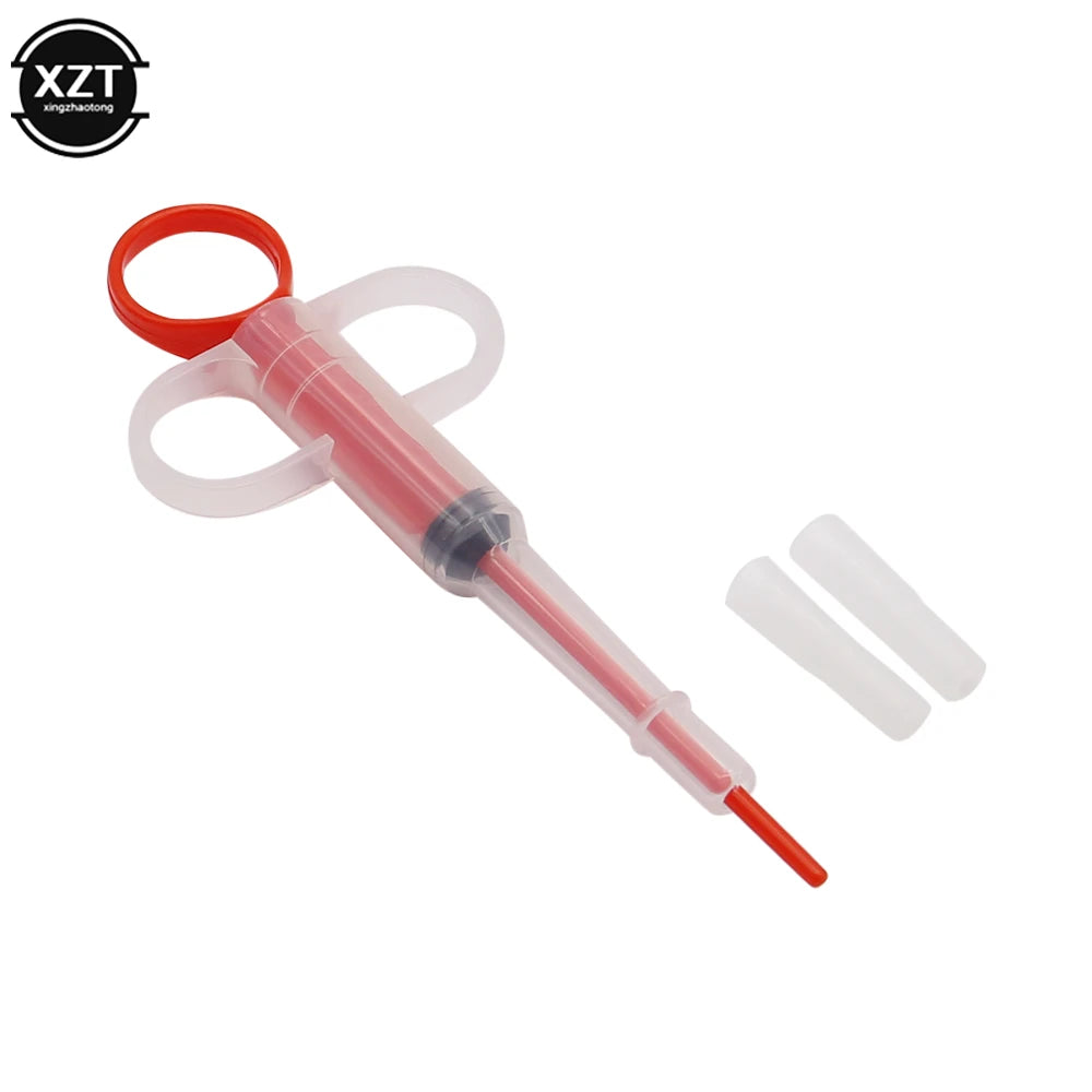 Pet medicine pill dispenser syringe for dogs and cats, featuring an easy-push red and clear plastic design for pets.