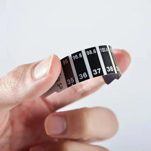 Black strip forehead baby thermometer for fast, non-invasive baby health temperature monitoring.